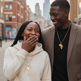 Two people standing together on a city street, smiling and laughing.