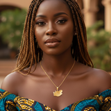 Woman wearing a patterned top with South Africa map necklace - a blurred background