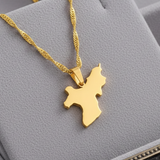Gold necklace with a map pendant on a gray jewelry display box